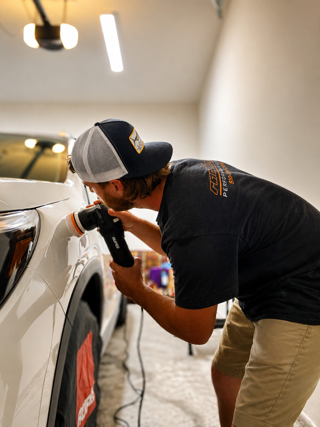 Home 6 professional paint correction on a white SUV by Aquamen Mobile Detailing in Wilmington, NC.